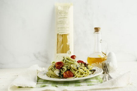 Spaghetti with clams, turnip greens and confit cherry tomatoes