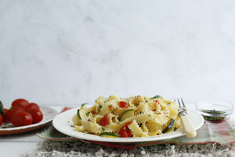 Reginelle with zucchini and cherry tomatoes