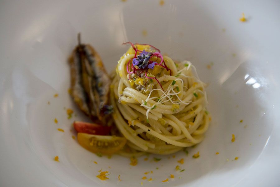 Spaghetti with mediterranean anchovies and a scent of citrus fruits