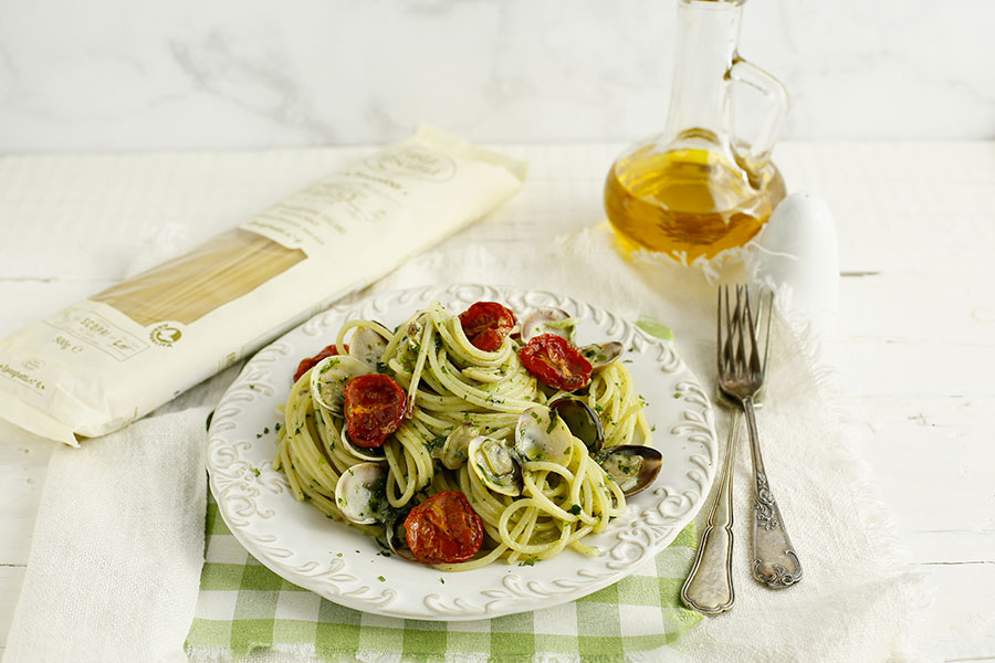 Spaghetti with clams, turnip greens and confit cherry tomatoes