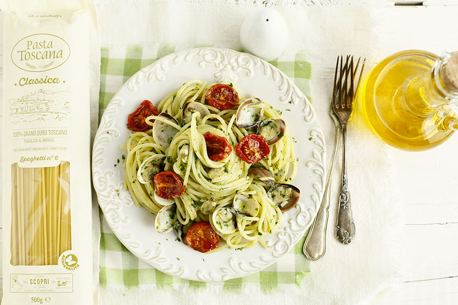 Spaghetti with clams, turnip greens and confit cherry tomatoes